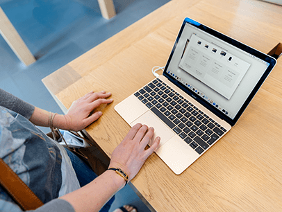 Person using laptop on a desk