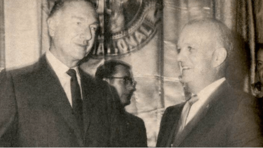 Two men holding award