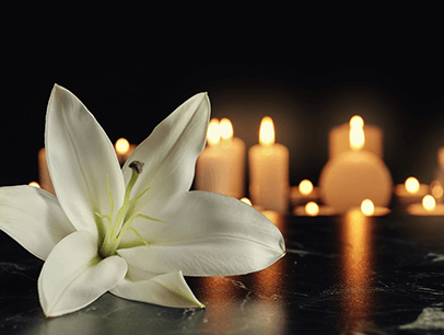Flower and lit candles