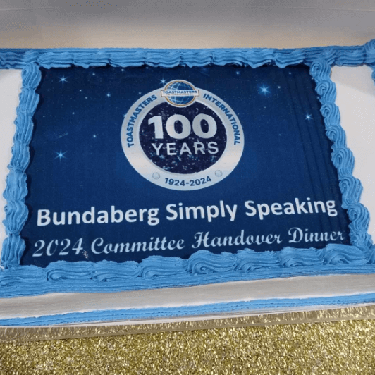 A cake with the centennial logo